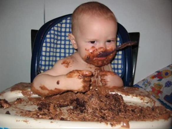 Baby-Eating-Cake-And-Making-Funny-Face